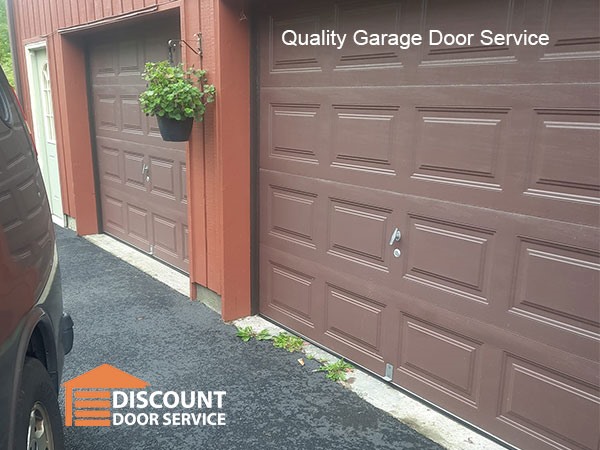 Two single car garage doors that had springs replaced